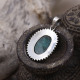 Pendentif en argent et racine d'Emeraude